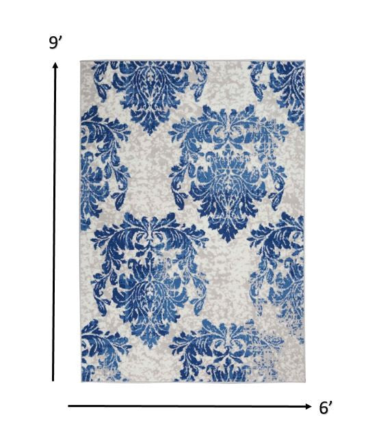 4' X 6' Blue And Ivory Floral Dhurrie Area Rug