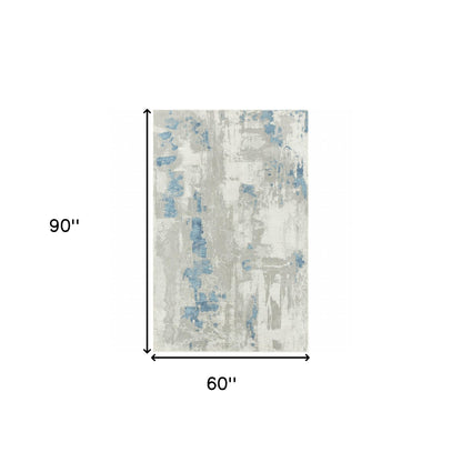 5' X 8' Ivory Gray And Blue Abstract Power Loom Stain Resistant Area Rug