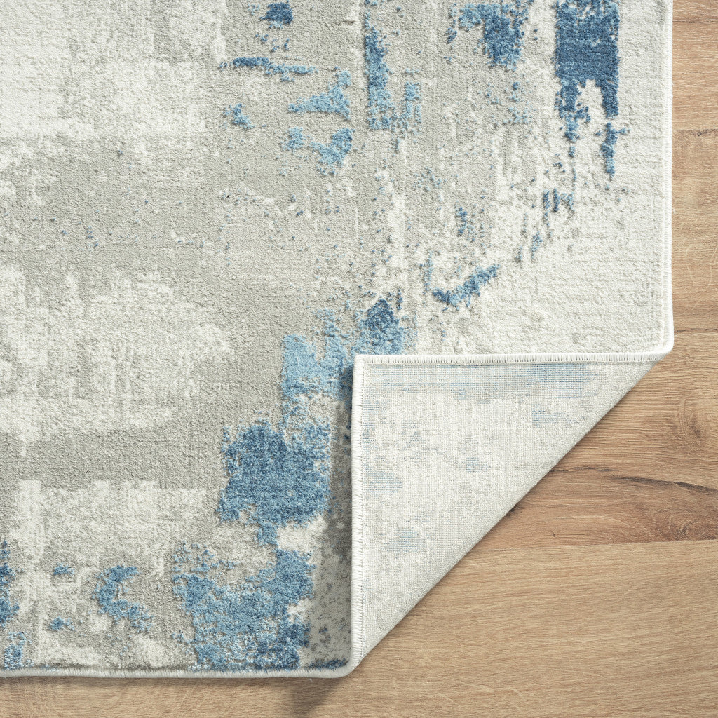 9' X 12' Ivory Gray And Blue Abstract Power Loom Stain Resistant Area Rug