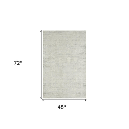 4' X 6' Ivory And Gray Floral Stain Resistant Area Rug