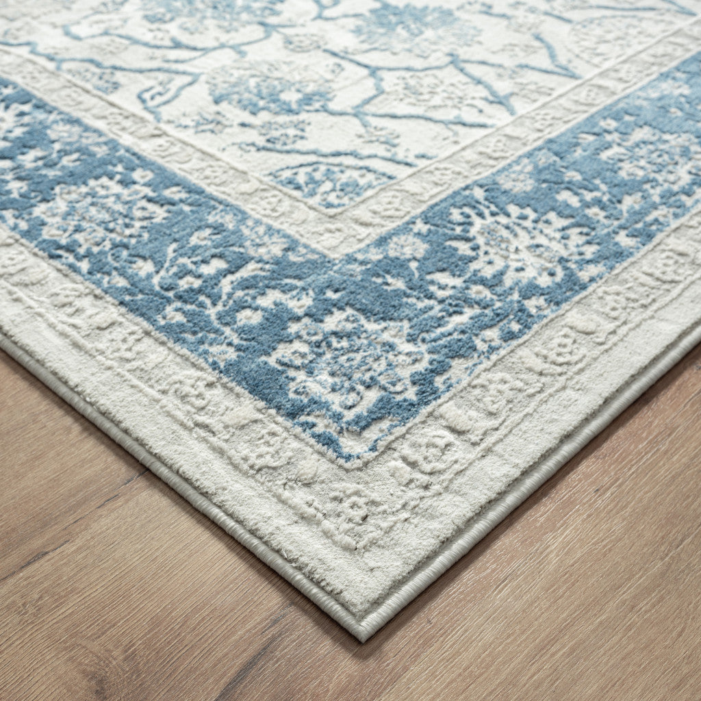9' X 12' Blue Gray And Ivory Floral Power Loom Stain Resistant Area Rug
