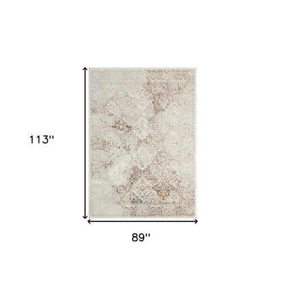 7' X 9' Beige Cream And Brown Damask Stain Resistant Area Rug