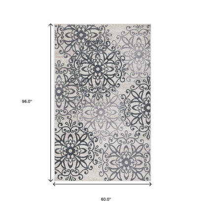 5' X 8' Oatmeal And Gray Medallion Power Loom Stain Resistant Area Rug