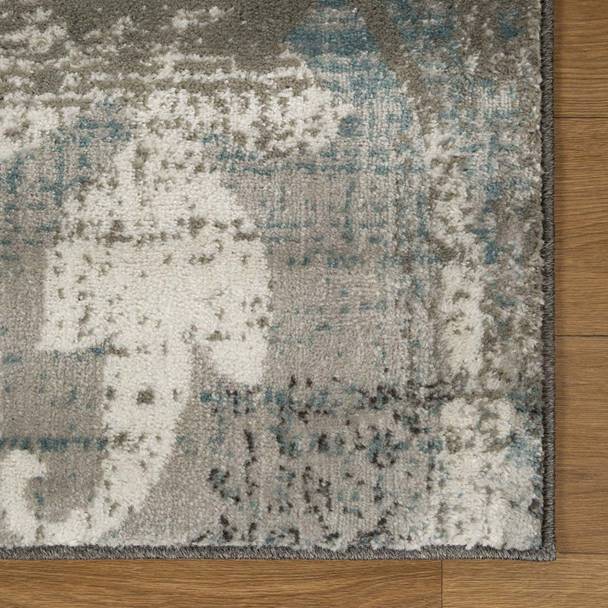 7' X 9' Teal Gray And Tan Floral Power Loom Distressed Stain Resistant Area Rug