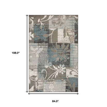 7' X 9' Teal Gray And Tan Floral Power Loom Distressed Stain Resistant Area Rug