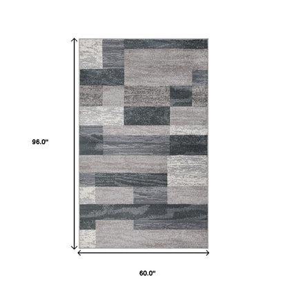 5' X 8' Blue And Taupe Patchwork Power Loom Stain Resistant Area Rug