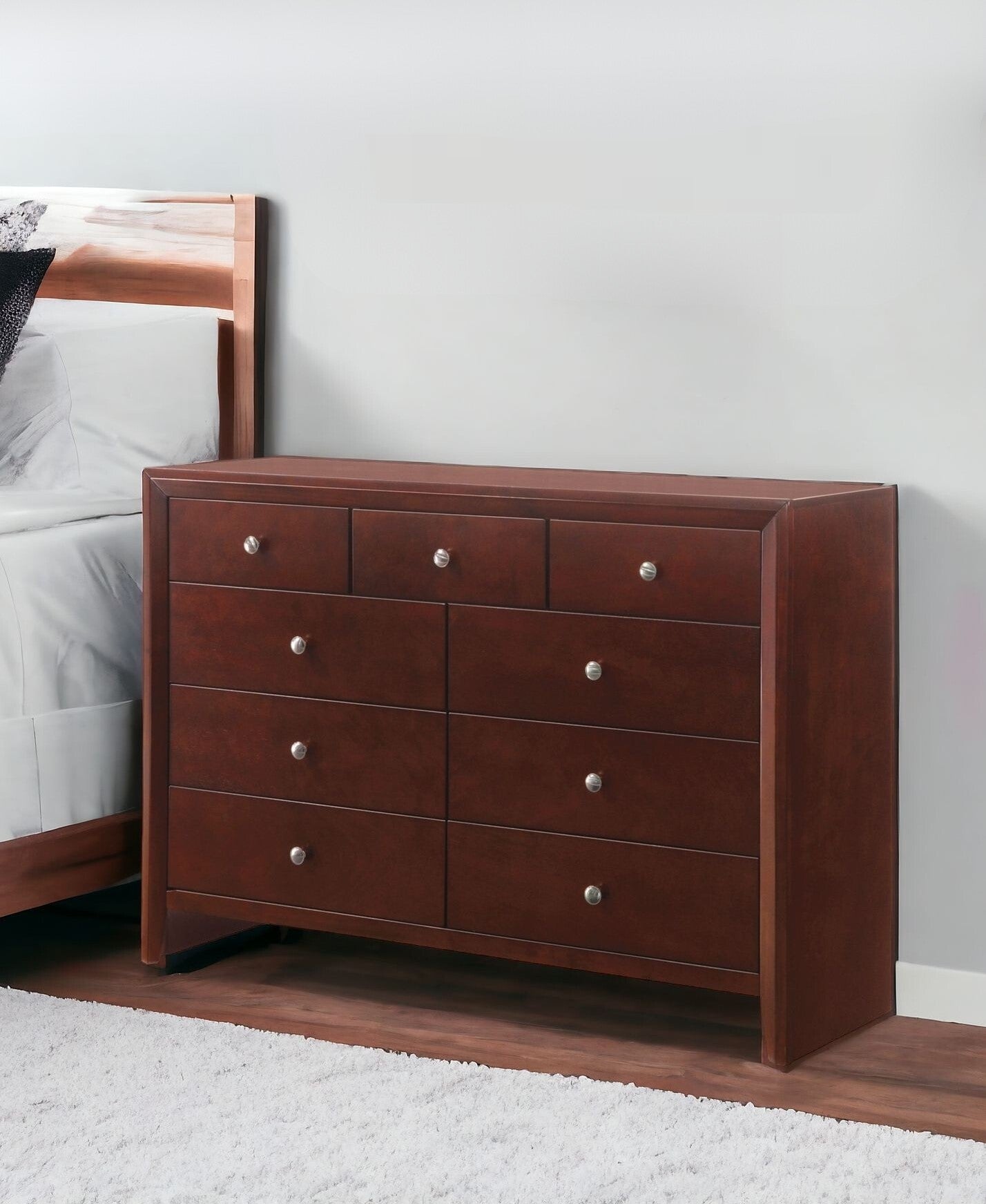 55" Brown Solid and Manufactured Wood Nine Drawer Triple Dresser