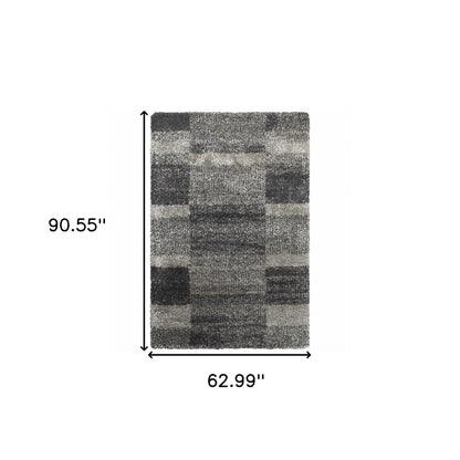 5' x 8' Black and Gray Geometric Shag Power Loom Area Rug