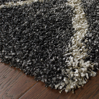 5' X 8' Charcoal And Grey Geometric Shag Power Loom Stain Resistant Area Rug