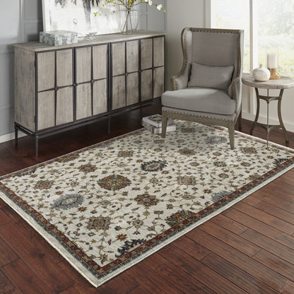 6' X 9' Beige Rust Red Blue Gold And Grey Oriental Power Loom Stain Resistant Area Rug With Fringe