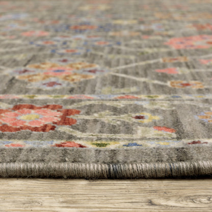 10' X 13' Grey Salmon Pink Gold Blue Rust Deep Blue Ivory And Green Oriental Power Loom Stain Resistant Area Rug With Fringe