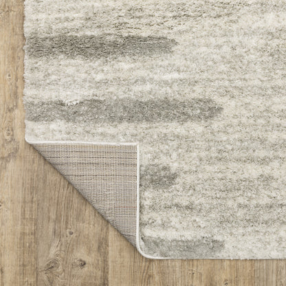 5' X 8' Ivory And Grey Geometric Shag Power Loom Stain Resistant Area Rug