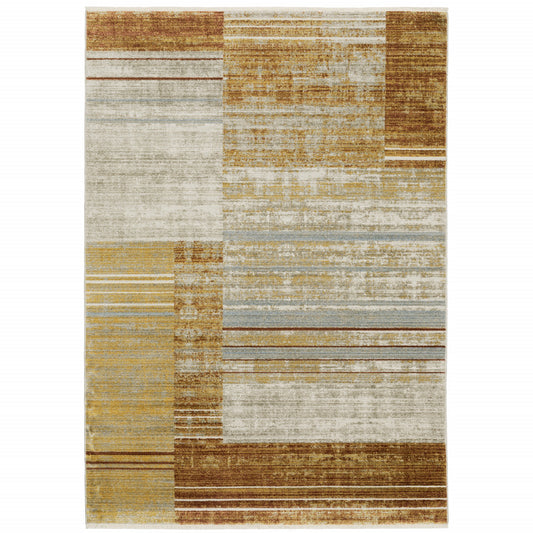 8' X 11' Rust Gold Blue Grey Ivory And Tan Geometric Power Loom Stain Resistant Area Rug With Fringe