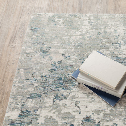 10' X 13' Blue Beige And Teal Abstract Power Loom Stain Resistant Area Rug