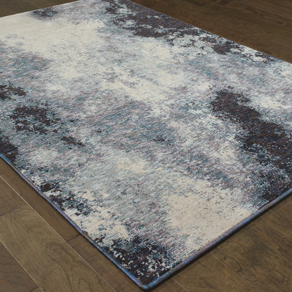 5' X 7' Navy And Ivory Abstract Power Loom Stain Resistant Area Rug