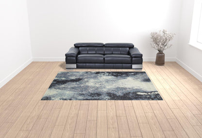 9' X 12' Navy And Ivory Abstract Power Loom Stain Resistant Area Rug