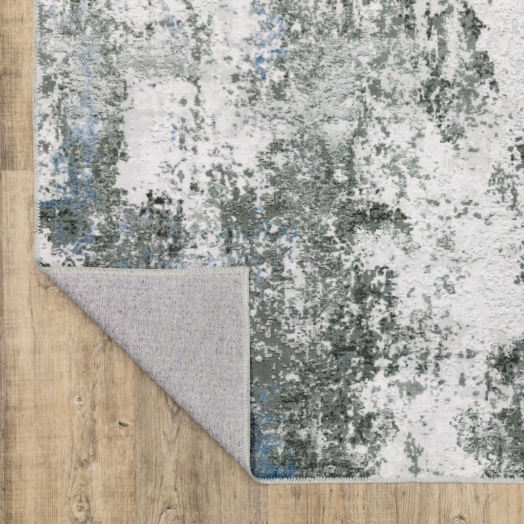 5' X 7' Silver Grey Charcoal And Light Blue Abstract Printed Stain Resistant Non Skid Area Rug