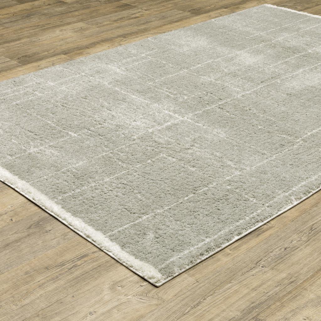 8' X 11' Grey And Ivory Geometric Shag Power Loom Stain Resistant Area Rug