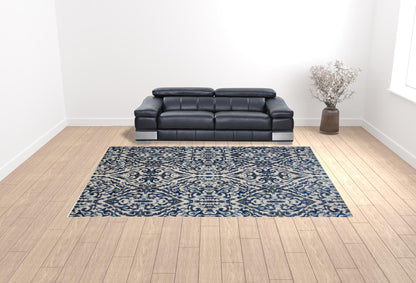 2' X 4' Blue Ivory And Black Floral Distressed Stain Resistant Area Rug