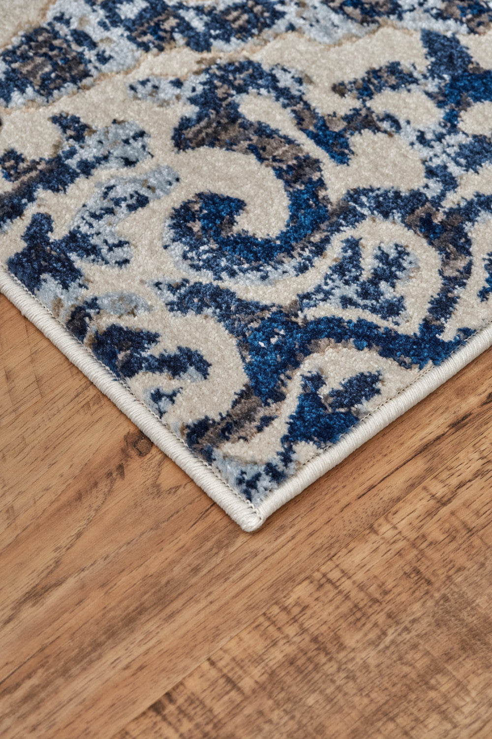 2' X 4' Blue Ivory And Black Floral Distressed Stain Resistant Area Rug