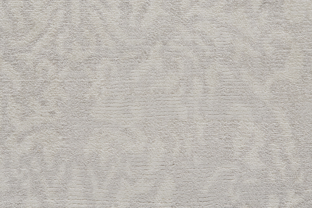 5' X 8' Ivory Gray And Tan Abstract Hand Woven Area Rug