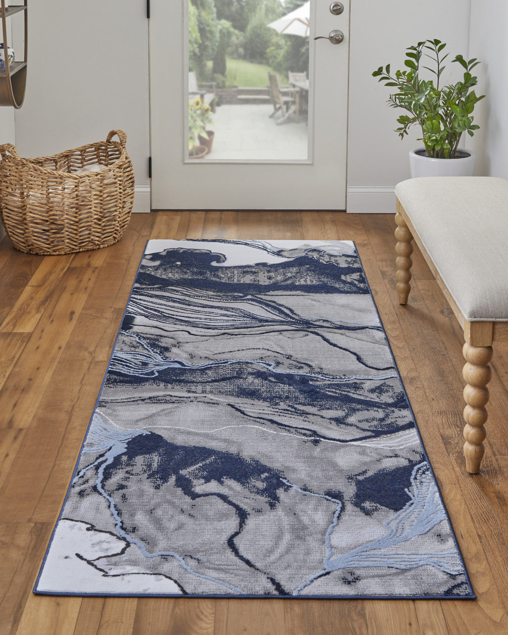 5' X 7' Blue Gray And Ivory Abstract Power Loom Stain Resistant Area Rug