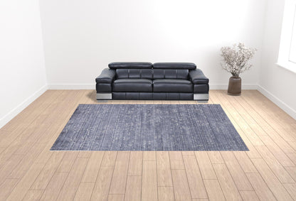 5' X 8' Blue And Ivory Abstract Hand Woven Area Rug