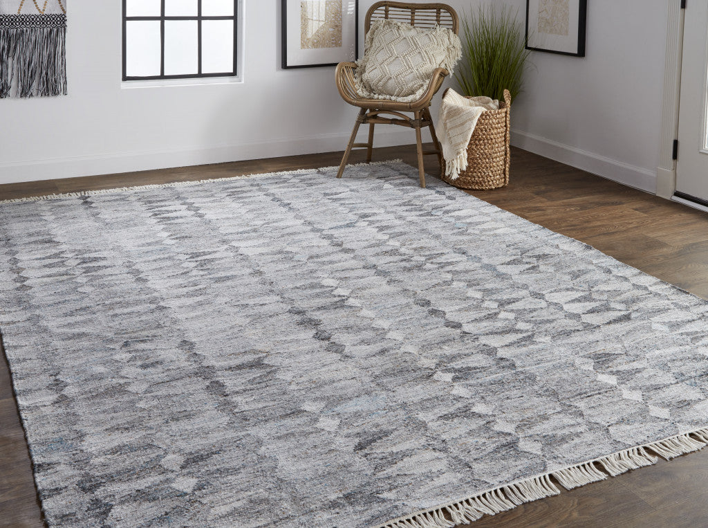 5' X 8' Gray Silver And Ivory Geometric Hand Woven Stain Resistant Area Rug With Fringe