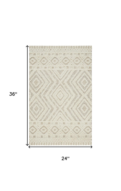 5' X 8' Ivory And Tan Wool Geometric Tufted Handmade Stain Resistant Area Rug