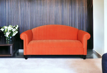 84" Orange Velvet And Black Sofa